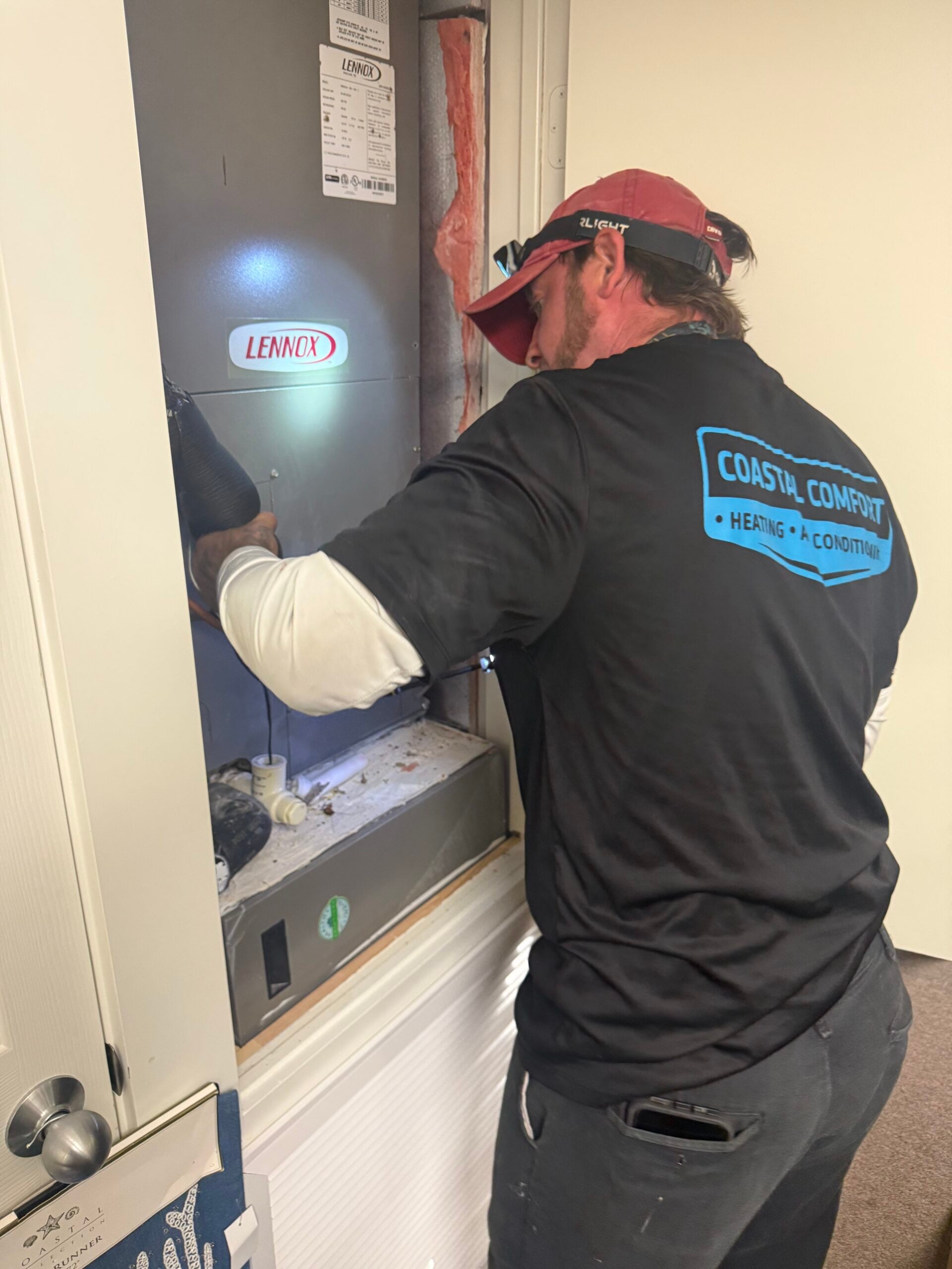 Technician servicing Lennox air handler