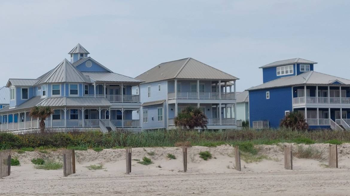 Raised beach houses along the Galveston shoreline exposed to salt air